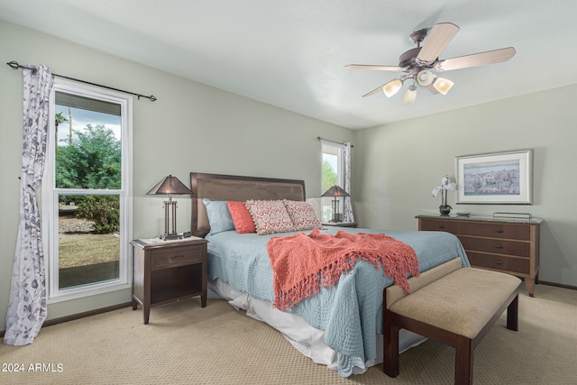 carpeted bedroom featuring ceiling fan