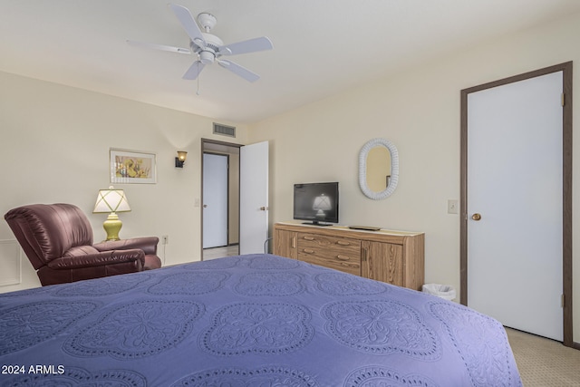 bedroom with ceiling fan and light colored carpet