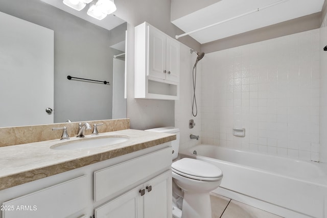 bathroom featuring tile patterned floors, toilet, vanity, and washtub / shower combination