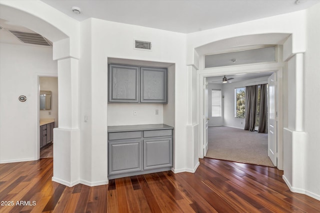 hallway with dark wood-type flooring