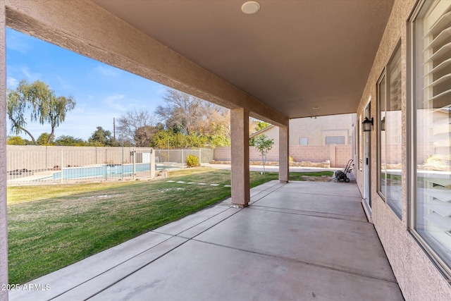 view of patio featuring a fenced in pool