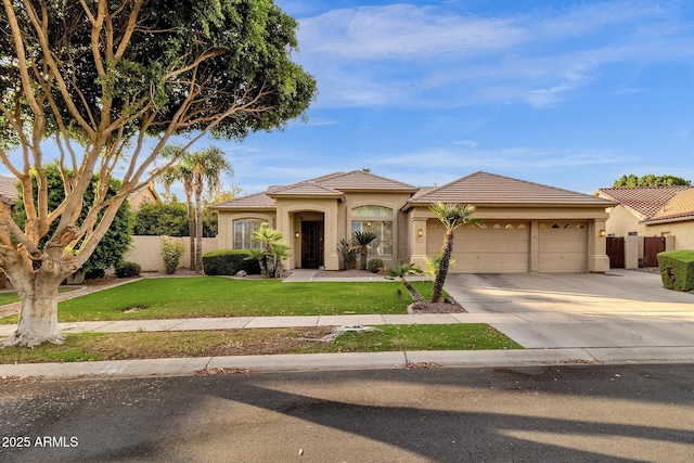 mediterranean / spanish house featuring a garage and a front lawn