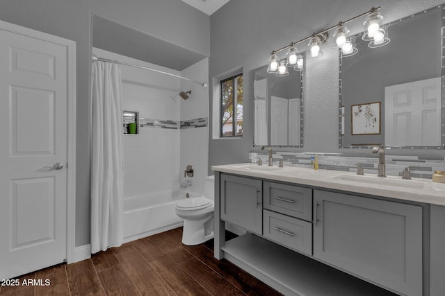 full bathroom with tasteful backsplash, shower / tub combo with curtain, vanity, and toilet