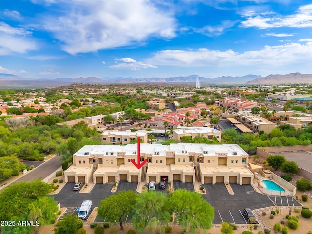 drone / aerial view featuring a residential view and a mountain view