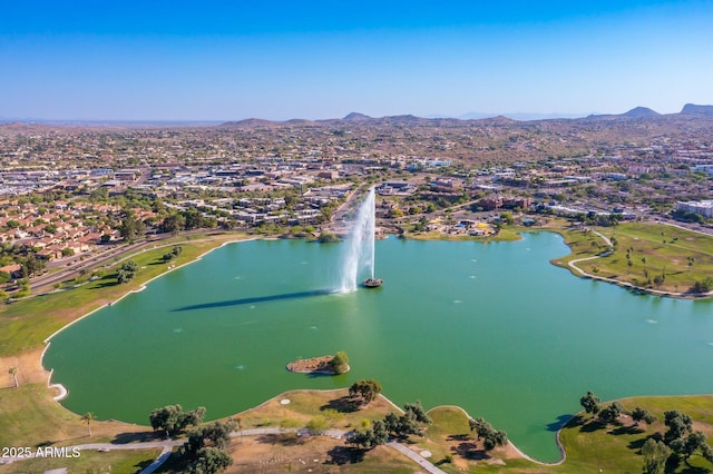 aerial view featuring a water and mountain view