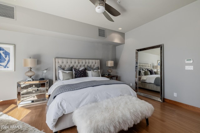 bedroom with hardwood / wood-style floors and ceiling fan