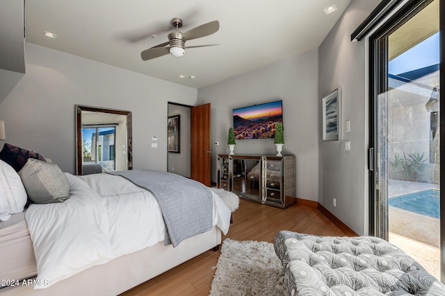 bedroom featuring ceiling fan, wood-type flooring, and access to outside