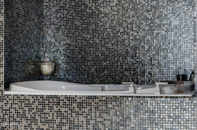 bathroom featuring tile walls