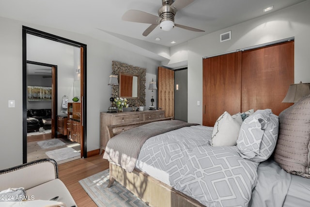 bedroom featuring ceiling fan and light wood-type flooring