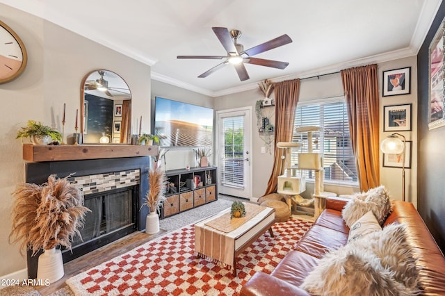 living room with ceiling fan and crown molding