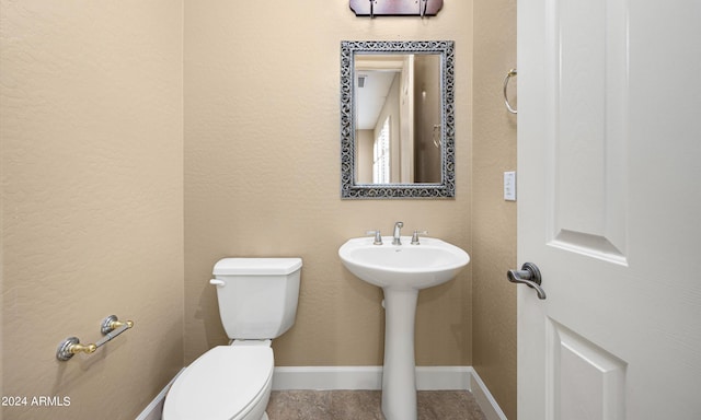 bathroom with sink and toilet