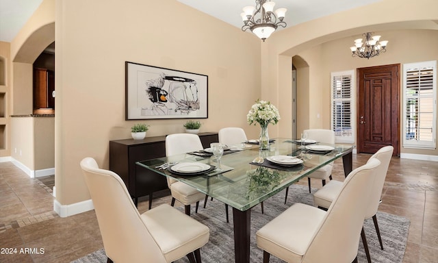 dining space with an inviting chandelier