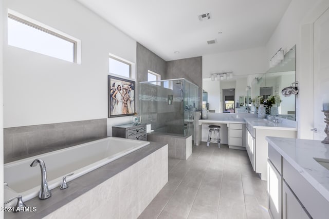 bathroom with separate shower and tub, tile patterned floors, and vanity