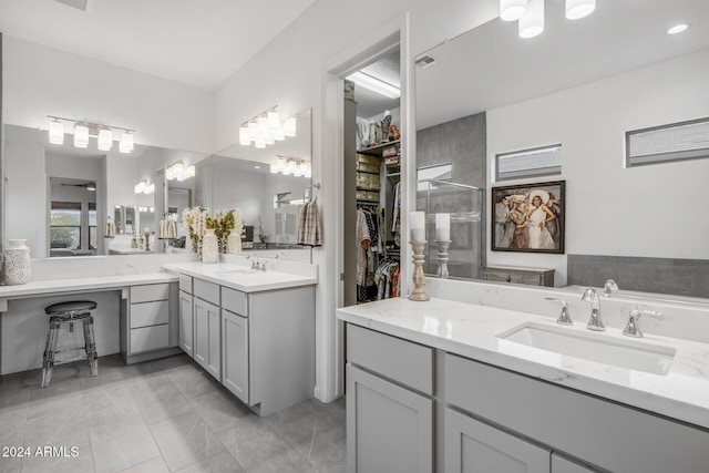 bathroom featuring tile patterned flooring and vanity