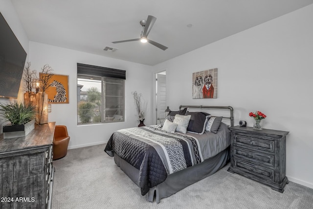 bedroom featuring ceiling fan and light colored carpet