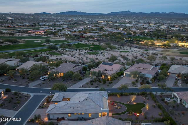 birds eye view of property with a mountain view