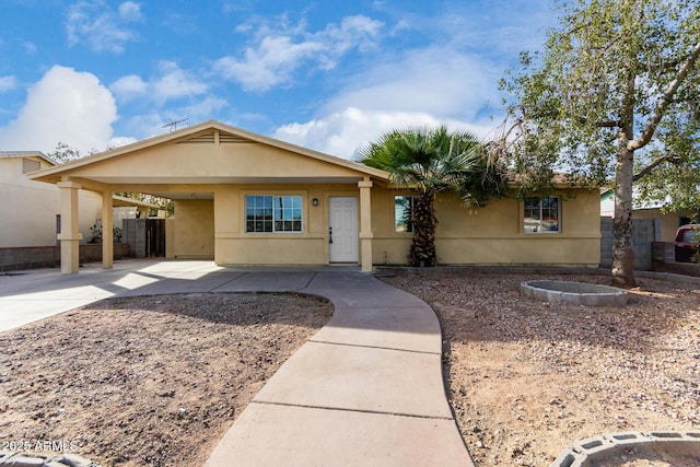 ranch-style house with a carport