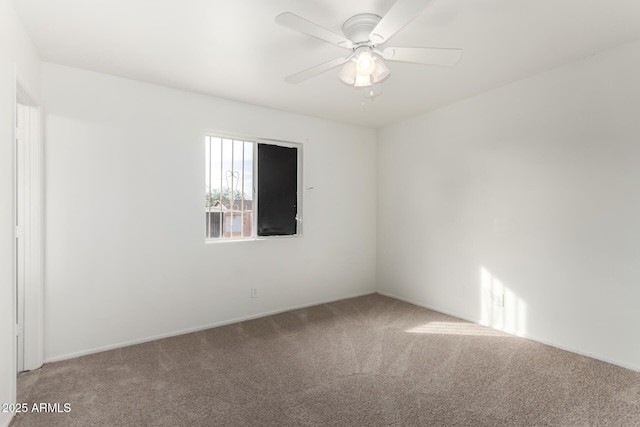 empty room featuring carpet and ceiling fan