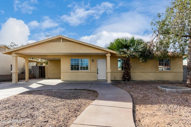 view of front of home with a carport