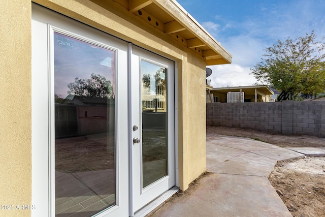 property entrance with a patio