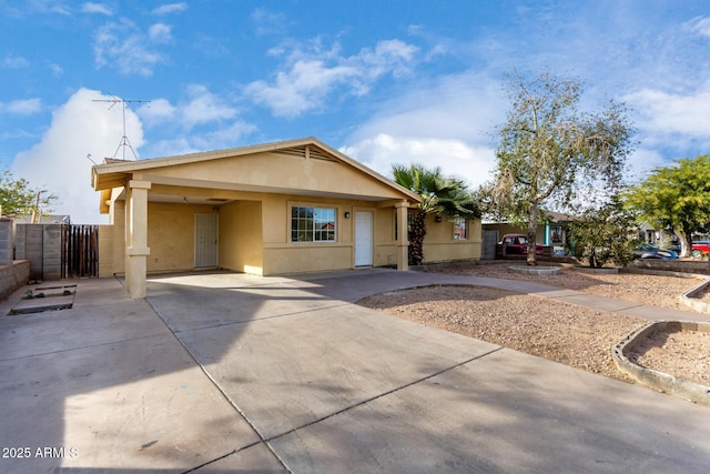 single story home featuring a carport