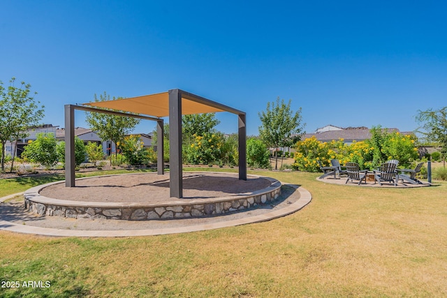 view of yard featuring an outdoor fire pit