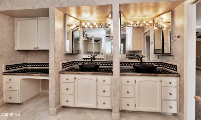 full bathroom featuring double vanity, a sink, and a ceiling fan