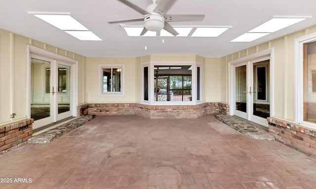 view of patio featuring french doors and ceiling fan