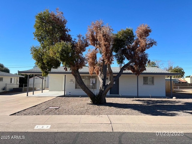 single story home with a carport