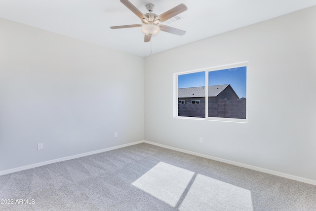 unfurnished room featuring carpet flooring and ceiling fan