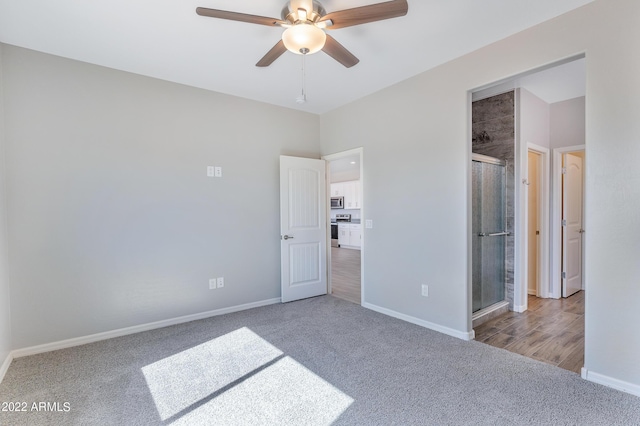 unfurnished bedroom featuring ceiling fan and carpet