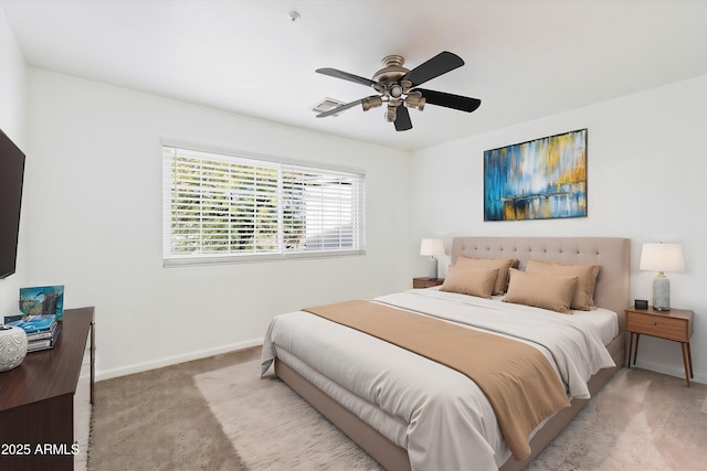 bedroom with light carpet and ceiling fan