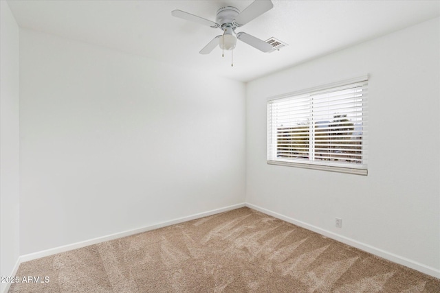 empty room featuring carpet and ceiling fan