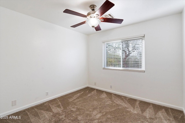 carpeted spare room with ceiling fan