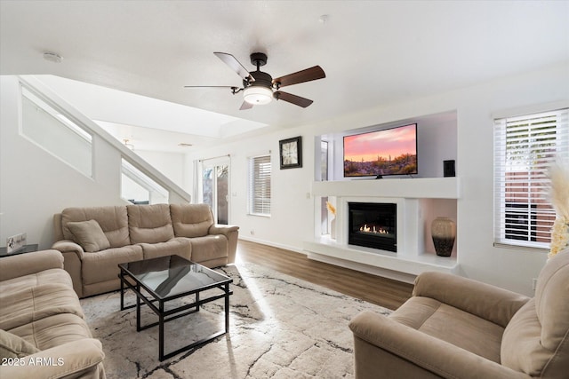 living room with ceiling fan and light hardwood / wood-style floors