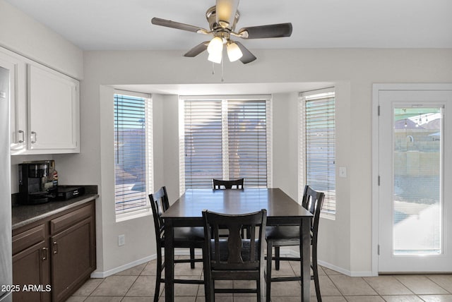 dining room featuring ceiling fan and light tile patterned floors