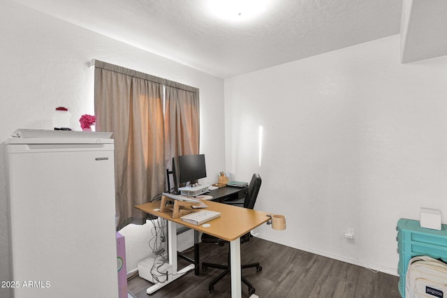 office area featuring a textured ceiling and dark hardwood / wood-style floors