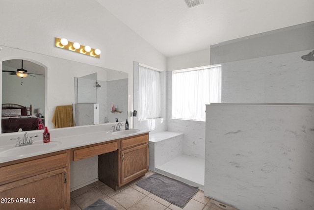 bathroom with walk in shower, vanity, tile patterned flooring, vaulted ceiling, and ceiling fan