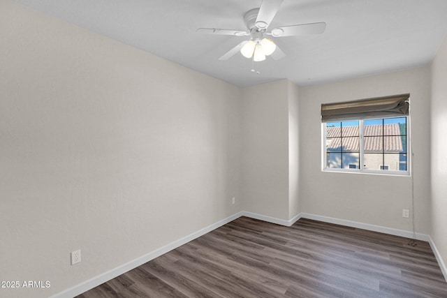 unfurnished room with ceiling fan and dark wood-type flooring