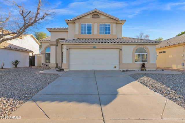 mediterranean / spanish-style house featuring a garage