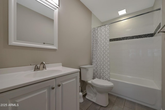 bathroom with shower / bath combo with shower curtain, toilet, and vanity