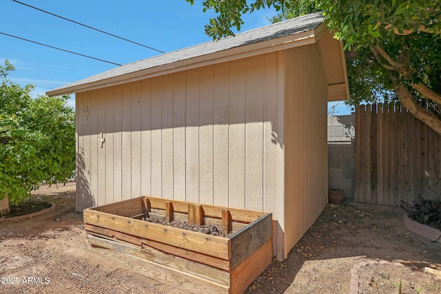 view of shed with fence