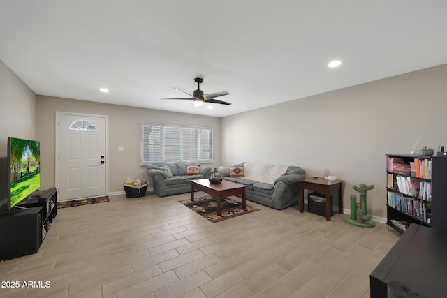 living room with recessed lighting, baseboards, ceiling fan, and light wood finished floors