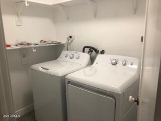 laundry area featuring washer hookup and washing machine and clothes dryer