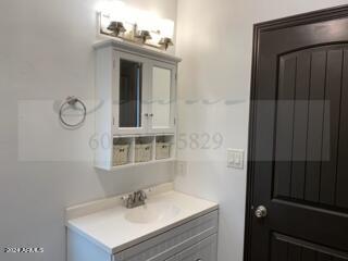 bathroom featuring vanity with extensive cabinet space