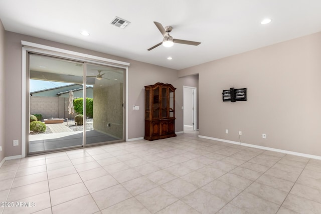 empty room featuring baseboards, visible vents, recessed lighting, and a ceiling fan