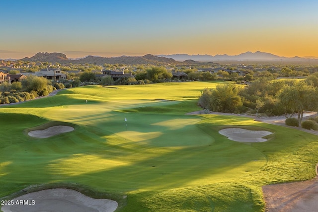 surrounding community with a mountain view