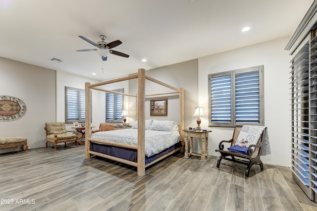 bedroom featuring hardwood / wood-style floors and ceiling fan