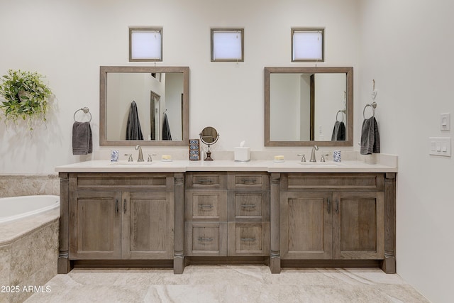 bathroom with vanity and tiled bath