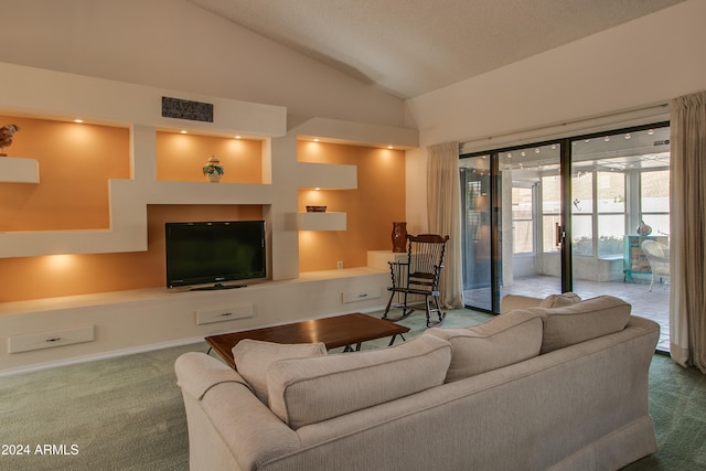 carpeted living room featuring high vaulted ceiling